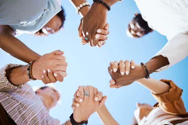 group of people holding hands